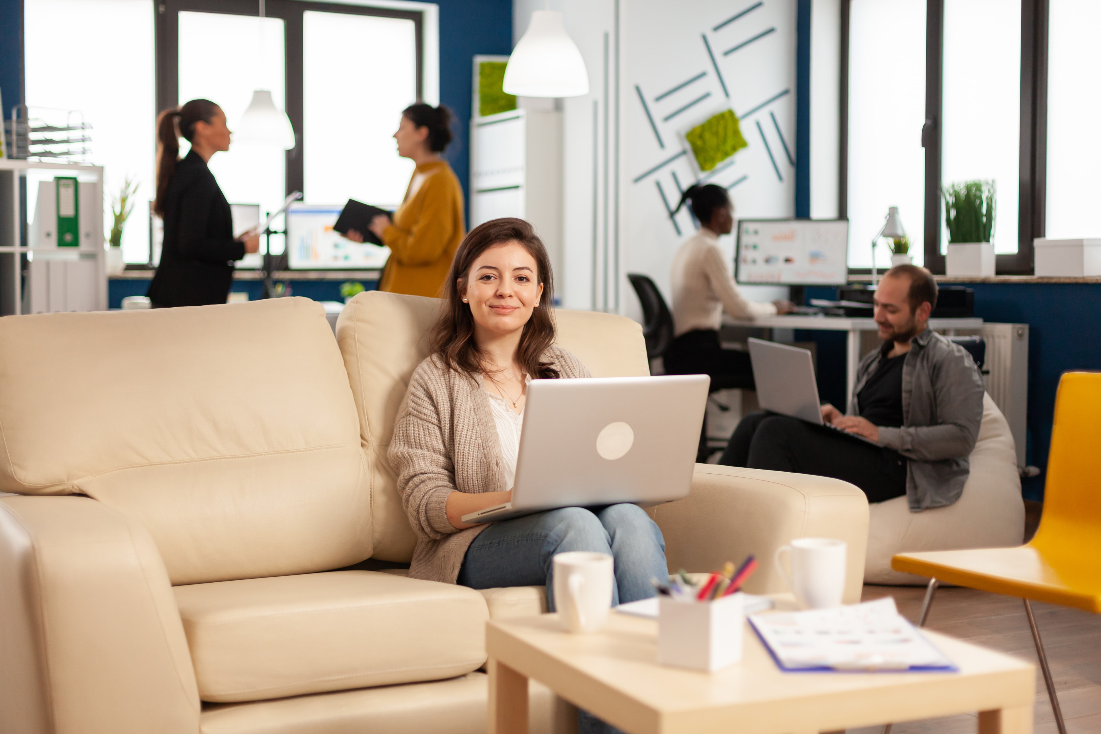 Team members working in the Next Champions office